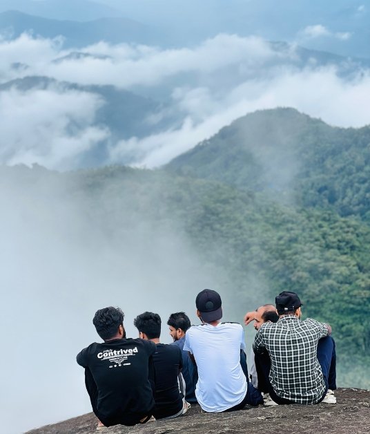 Friends taking in the misty hills around Nayadampoyil